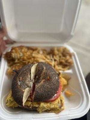 Bacon egg cheese bagel sandwich with Hash Browns