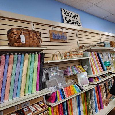 Bolts of fabrics in every hue imaginable