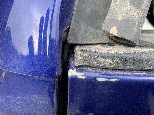 Why has the paint been stripped from the corners of the tailgate of my 2022 Tacoma?  Other side down to bare metal.
