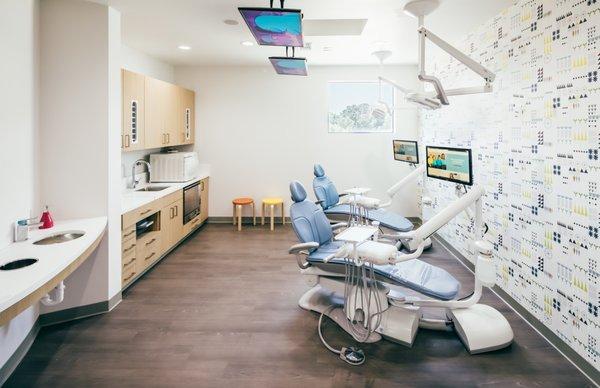 Each treatment chair is fitted with overhead LED monitors playing a wide array of cartoon titles