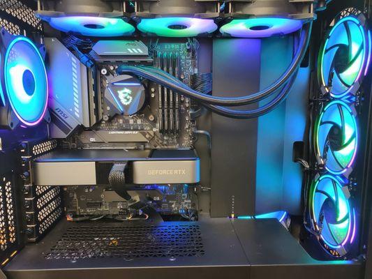 A beautiful custom build. Clean and mostly black, with RGB accents.