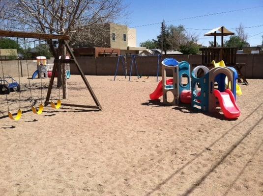 Yard surrounded by block wall.