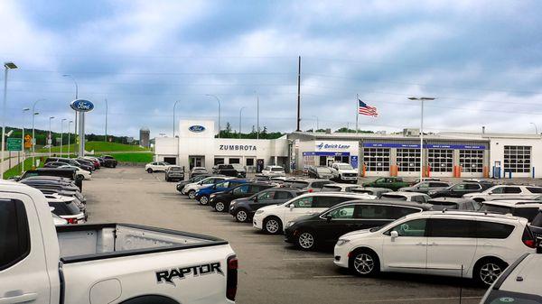 Some of Mosaic Ford Zumbrota's inventory with the building in the background.