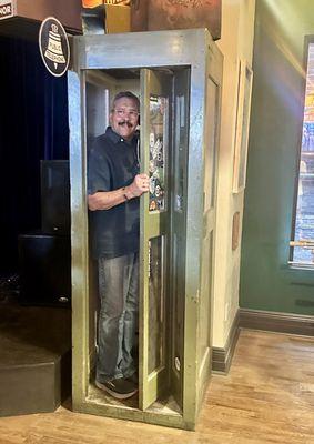 Enjoying the old fashioned telephone booth