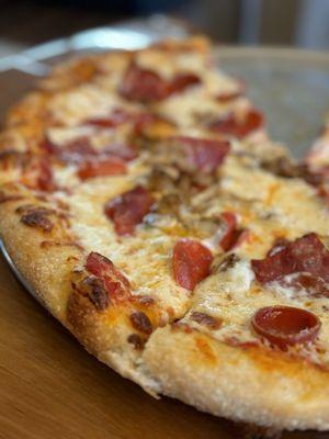 Wife was hangry so took the picture of only half of the Meat Lover's pizza