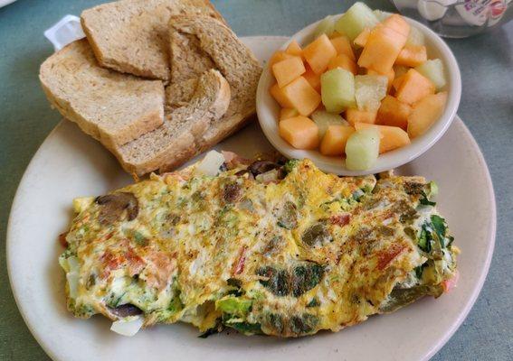 3 Egg Veggie Omelette with Fruit and Homemade Wheat Bread