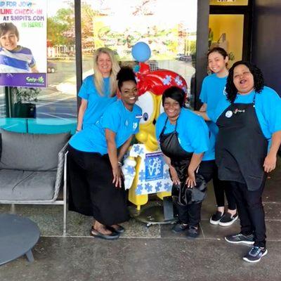Snip-its Haircuts for Kids staff celebrating Autism Awareness month