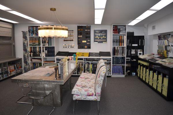 Step into The Atelier -- our design space with samples, seating, and expert help to bring your wallpaper and window treatment ideas to life!