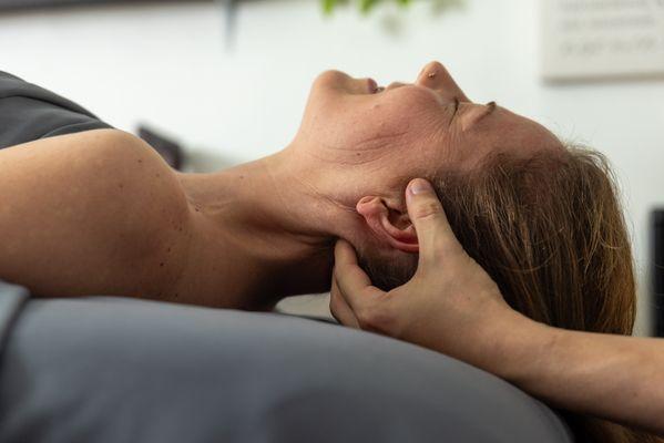 Relieving tech neck tension with precision and care.