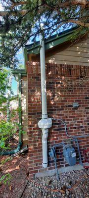 Radon Mitigation System w/ standard white 3" PVC pipe.