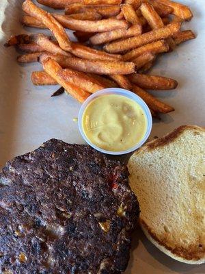Veggie burger and sweet potato fries with honey mustard