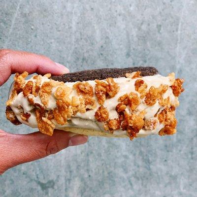 carmelized krispies & carmelized coffee ice cream between dbl choc cookie & lemon cookie