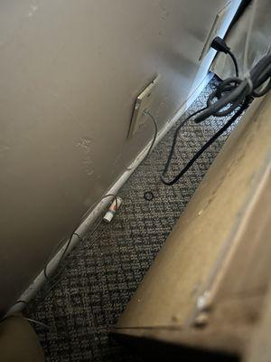 Behind the nightstand