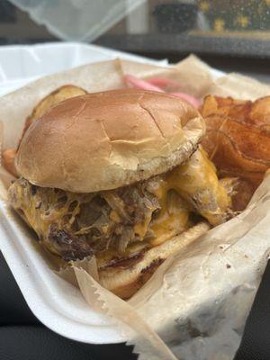 Double brisket burger with pulled pork and house made chips