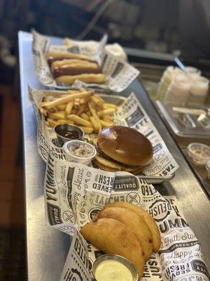 Empanadas, bbq pull pork sandwich and hot dogs