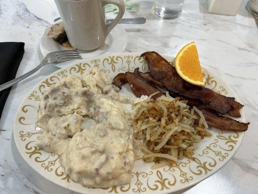 1/2 order biscuit & gravy, side of 3 pieces of bacon with hash browns shared from Hubs plate.