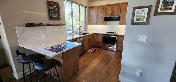 Reconfigured kitchen to allow more space and level counter.