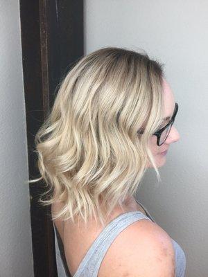 Beautiful blonde balayage with a dark shadow root
