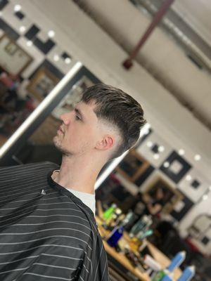 Mid skin fade with textured top to look full.