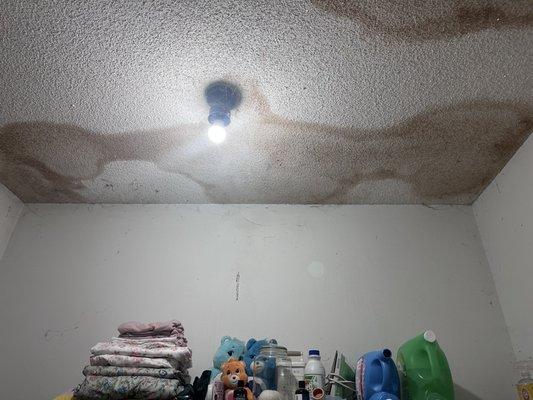 Less than 24 hours after the technician left my home, this is what my ceiling looked like after water leaked through the ceiling light!