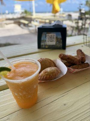 Frozen mango margarita , Argentinian empanadas and ham croquetas