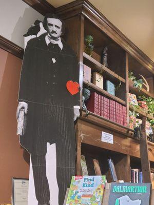 Behind register Edgar Allen Poe cardboard cut out