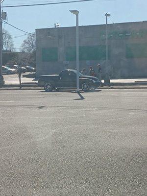 There was this teenager boy he listen to his friends to get a broken chair with wheels that belong to the employees from the gas station.