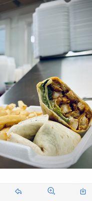 Buffalo chicken wrap with French fries.