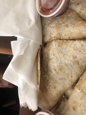 There was napkins stuck in the quesadilla!