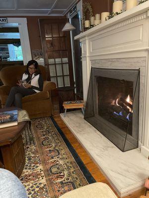 My wife reading by the Fireplace!