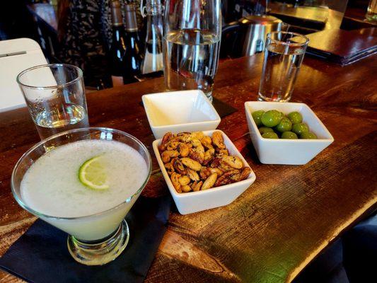 PerfectG gin cocktail with lavender, rosemary nuts and olives.