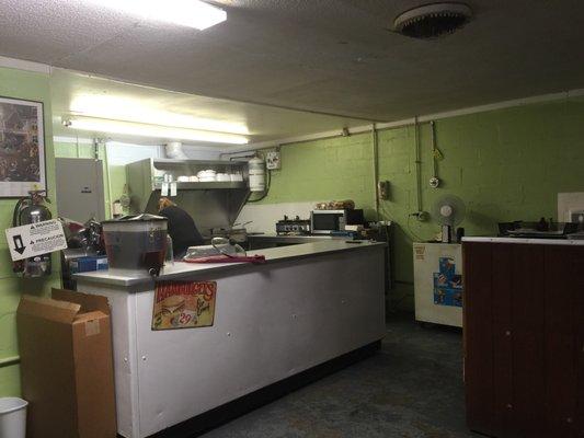 Christy the owner cooking us breakfast.