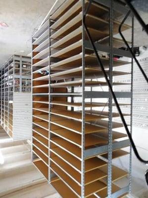 Two sections of backroom shelving, showing how many or how few shelves you can fit per section.