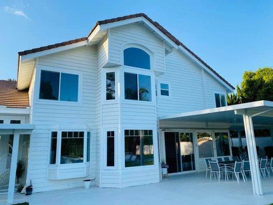 Where the windows are breathing in the light