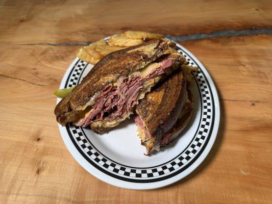 Our Corvette sandwich grilled pastrami, zesty sauerkraut, Swiss cheese, Russian dressing on grilled marble rye.