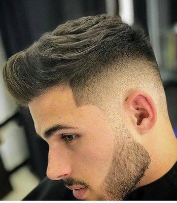 Comb over with fade and beard sculpture.