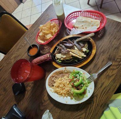 Mixed Fajitas rice, beans, salad, avocado, a Passionfruit Agua Fresca Grande, chips and salsa.