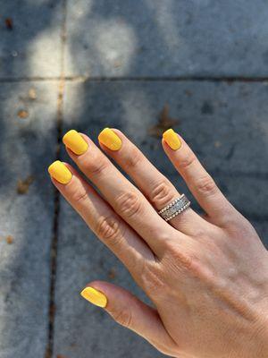 Bright yellow gel manicure - perfect for summer vibes!