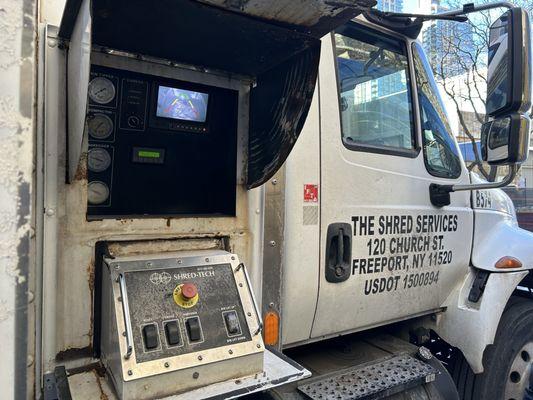 The paper shredding truck and monitor where you can witness the shredding process