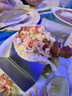 One of the three fish tacos in the order.