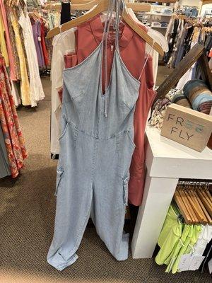 Light wash jean jumpsuit with cute pockets front view!