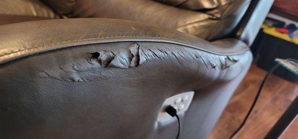 A little closer look. This sofa is only 5 years old. We were told we were buying leather. Leather does not delaminate.