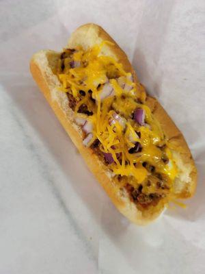 Chili dog with cheese and onions