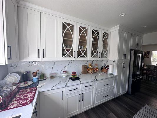 Cabinets, quartz, wood plank floor,