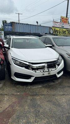 Cars parked extremely close by to each other.