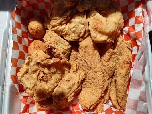 Fried catfish, shrimp and oysters, and hush puppies. The fries are so delicious that I had already guzzled them, LoL.