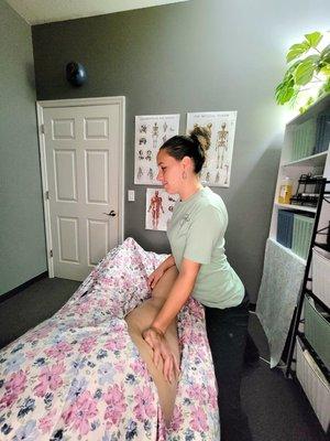 Brittney Mills working on a clients left leg.