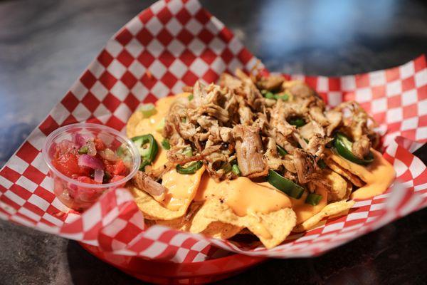 Nachos with shredded pork, cheese and jalapeño