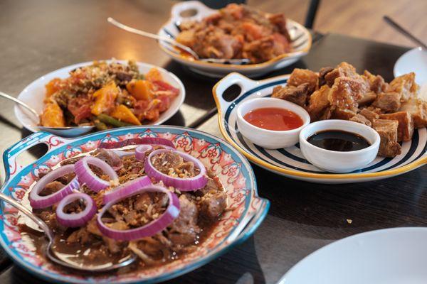 Bistek Tagalog (Front), Ginisang Ampalaya (Left), Lechon Kawali (Right), Chicken Afritada (Back)