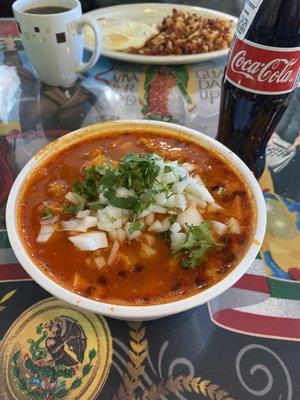Small menudo and a Mexican Coke. Chorizo con Papa and eggs in the background.